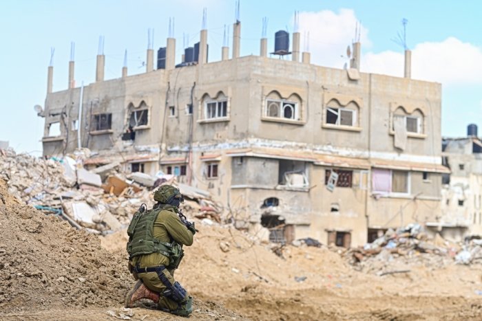 Han Yunis - Feb 7th 2024, Gaza stip. An IDF infantry commando soldier is covering towards ruin building.