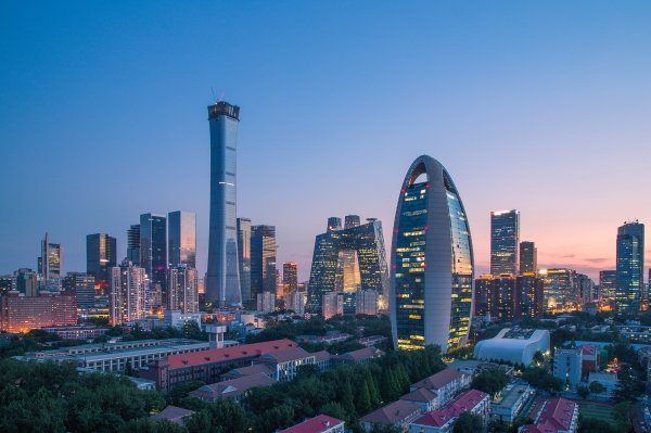 A photo of the Beijing skyline at dusk.