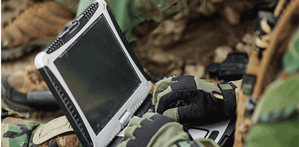 Soldier working on a laptop