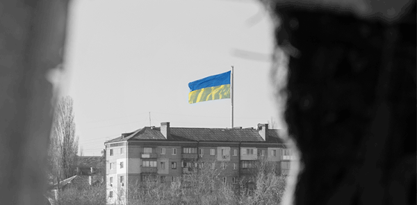 Ukrainian Flag Through Broken Window