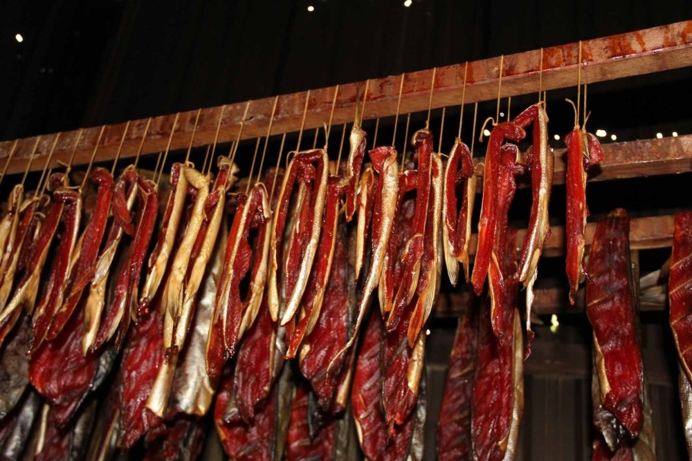 Smoking salmon in a smokehouse