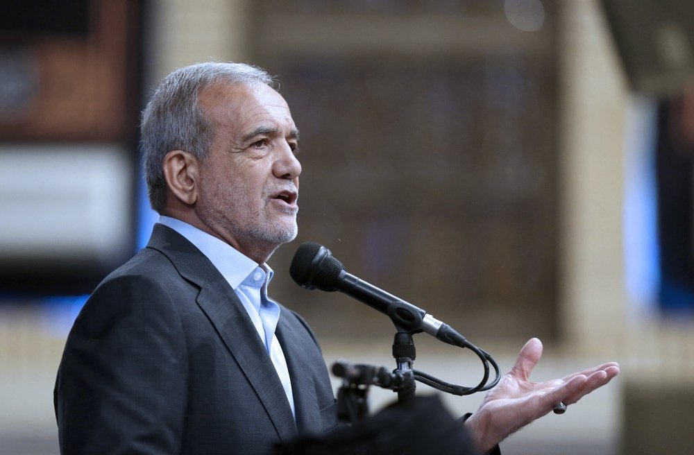 Iranian President Masoud Pezeshkian at podium