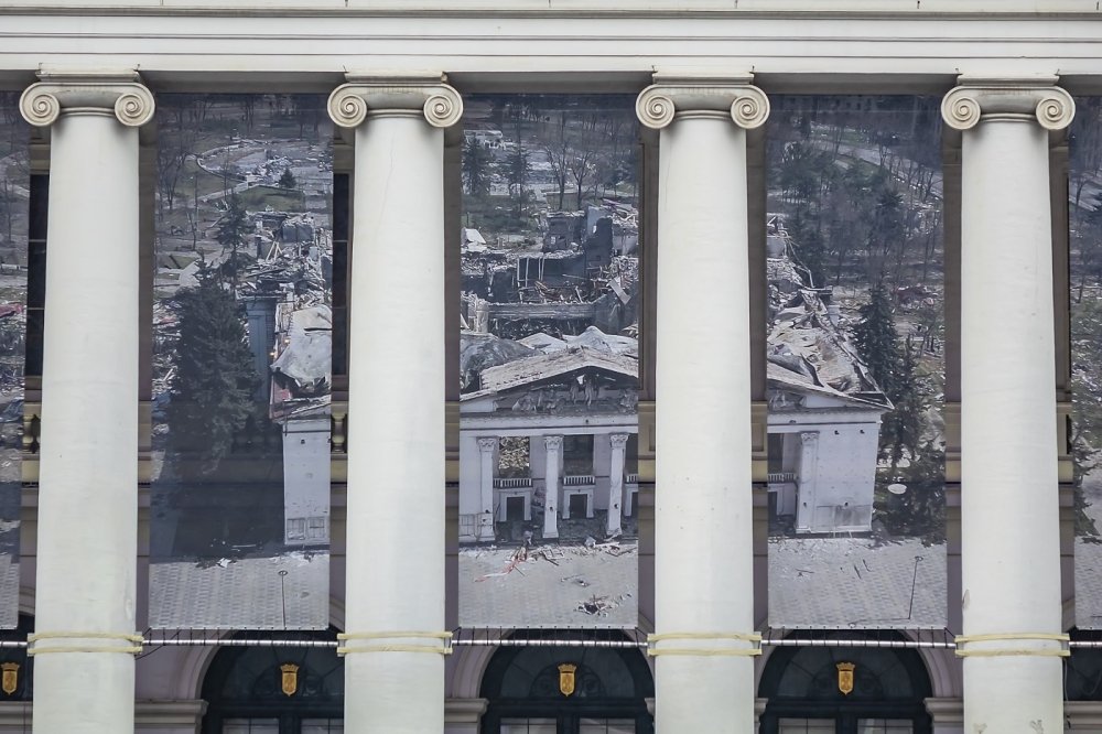 Theater facade, banner showing destroyed Mariupol Theater