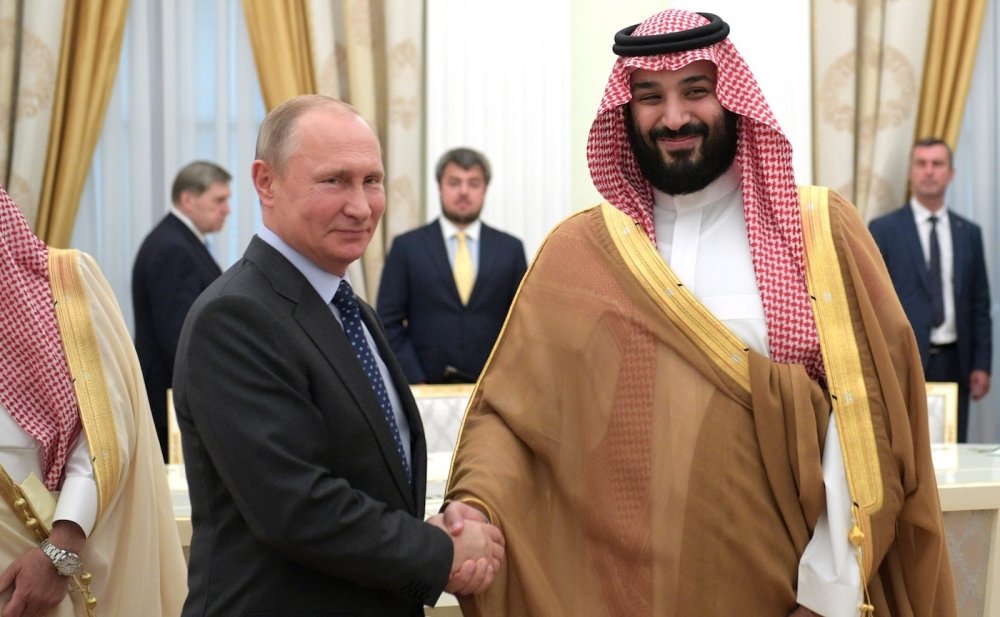 Vladimir Putin shaking hands with Crown Prince of Saudi Arabia Mohammad bin Salman.