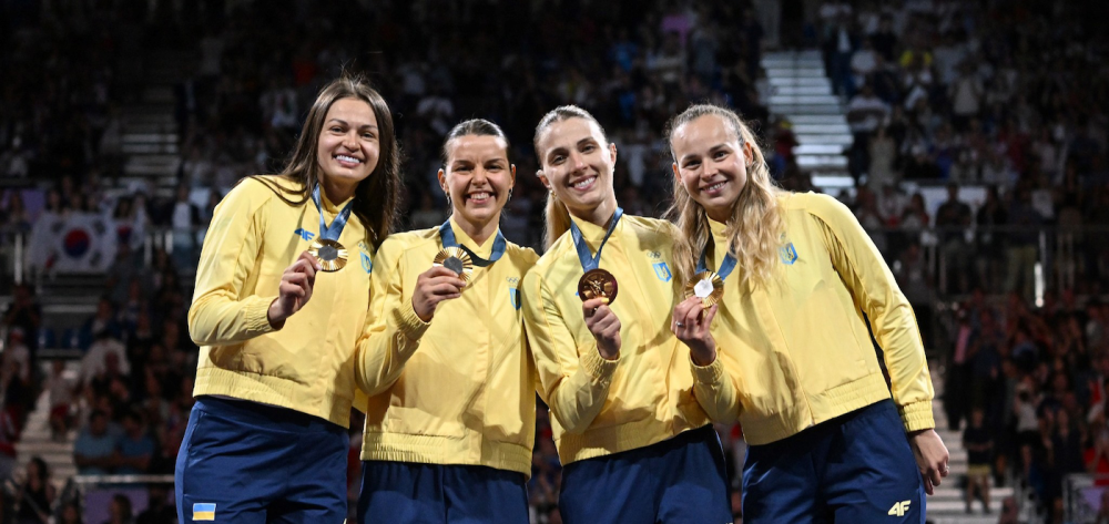 Gold medalists Olena Kravatska, Alina Komashchuk, Olga Kharlan and Yuliya Bakastova during the victory ceremony for the women's team sabre event at the Grand Palais during the 2024 Summer Olympics.