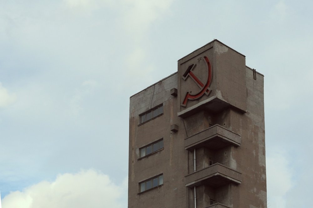 Sickle and hammer on a Soviet building