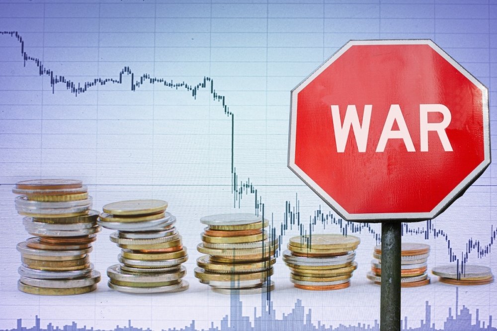 War sign on economy background depicted through a graph and coins.