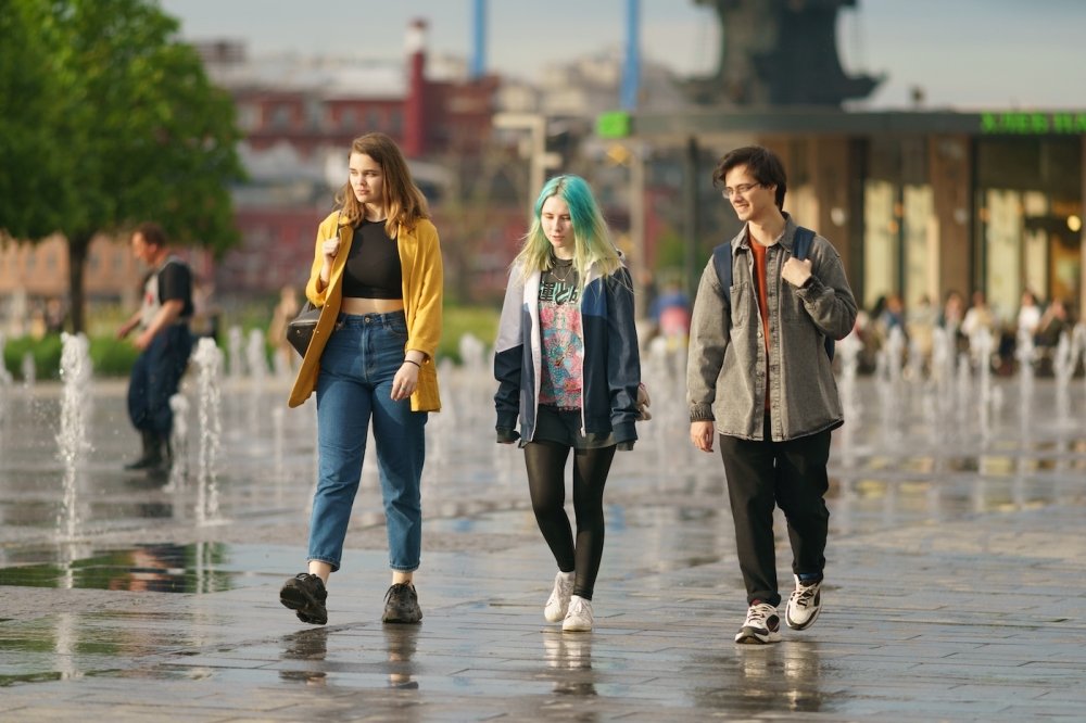 Moscow, Russia - June 1, 2022: Teenagers walking across the dry fountains.