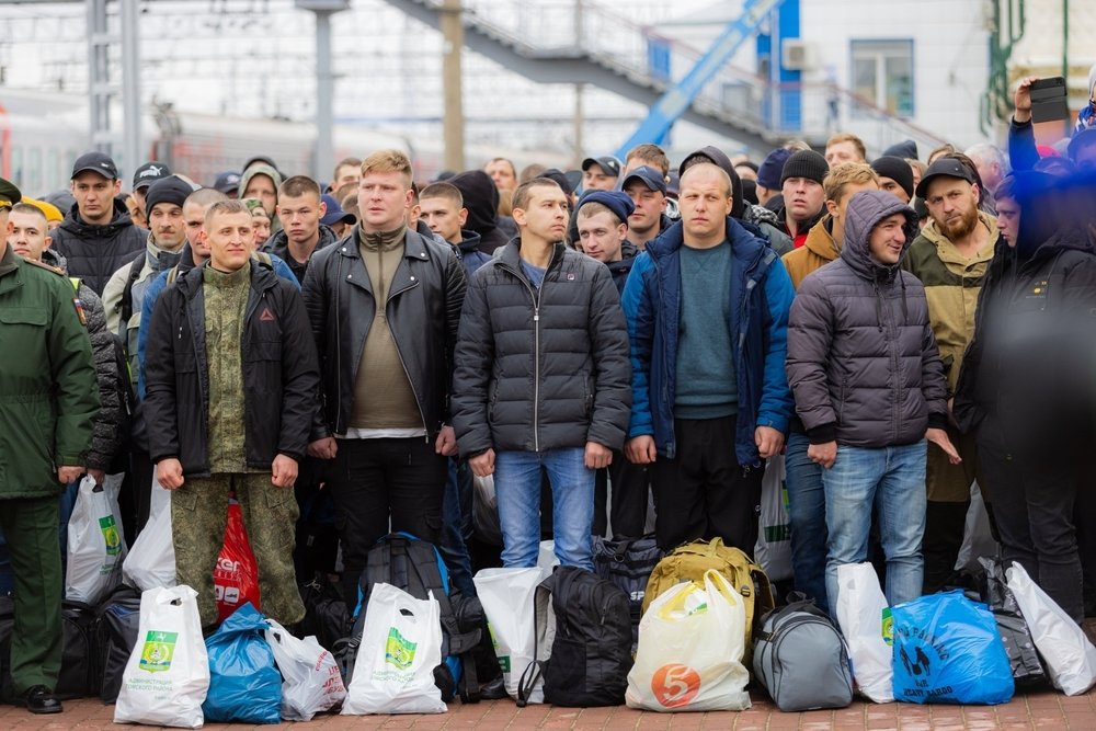 Russian conscripted men at a soldiers recruiting office during Russia's military mobilization