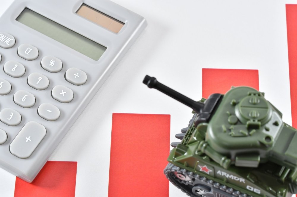 image of a calculator and toy tank