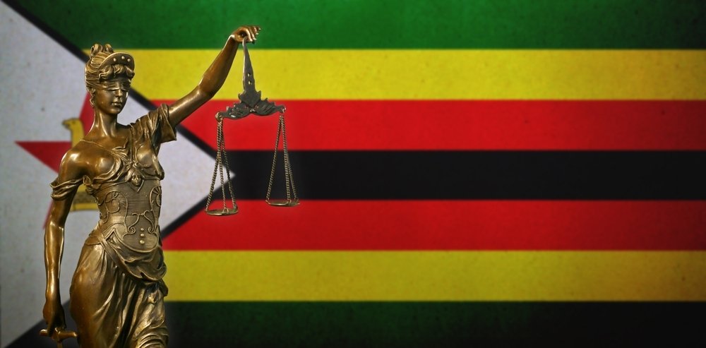 Symbol of Lady Justice and Flag of Zimbabwe