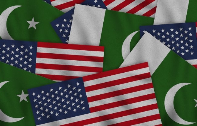 Flags from the U.S. and Pakistan overlapping each other.
