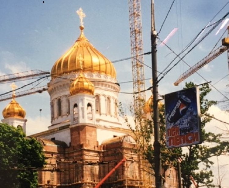 A photo of the Cathedral of Christ the Savior under construction, with a Pepsi ad in the shot.