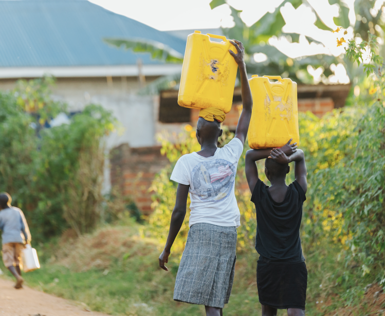 women carrying water in Uganda