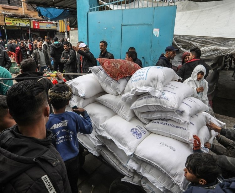 Palestinians crowd to receive food supplies at a UNRWA school after some Eur and American countries announced the cessation of support for UN in the Gaza Strip, in Gaza Strip, on January 24, 2024.