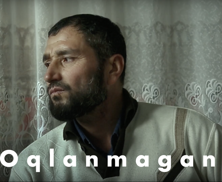 still from film Oqlanmagan with title overlaid