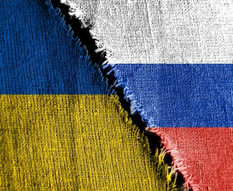 Russia Ukraine flag with tear