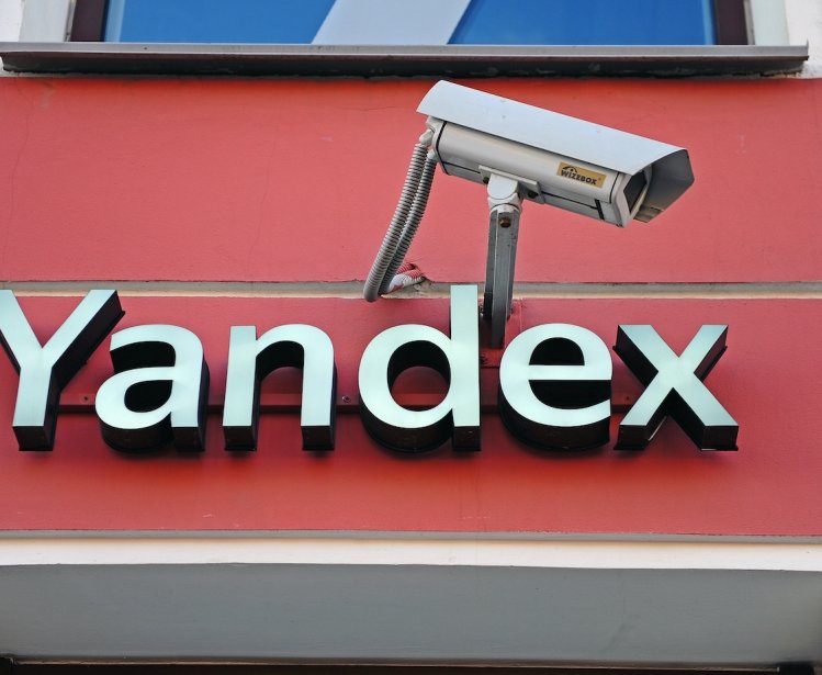 Yandex city store facade and logo accompanied by a surveillance camera