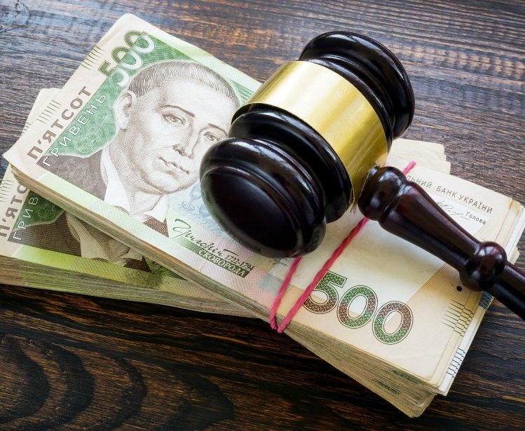 Ukrainian hryvnia money and a gavel