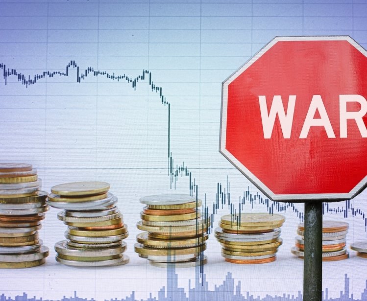 War sign on economy background depicted through a graph and coins.