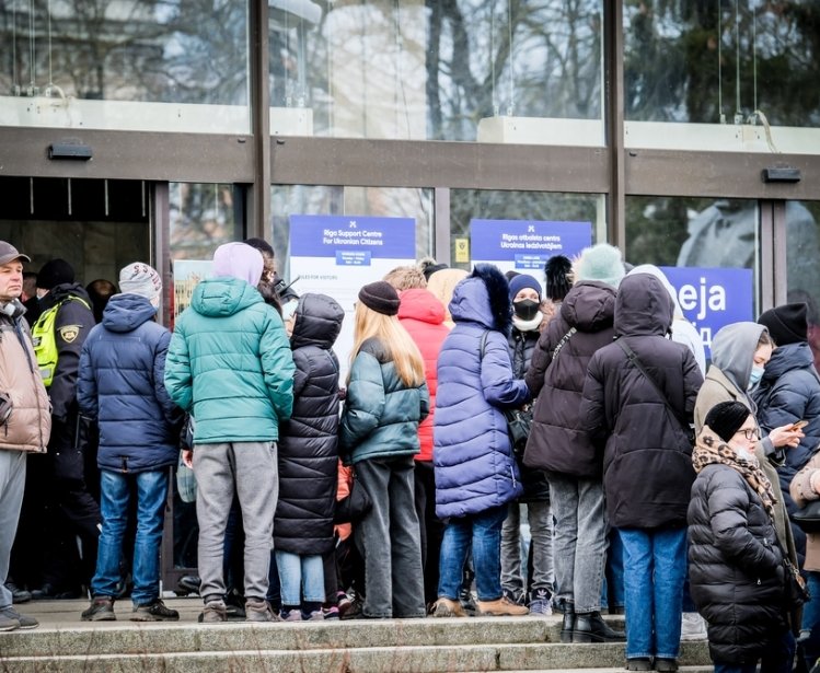 Ukrainian refugees that fleeing from the war in Ukraine gather at a refugee reception center in Riga, Latvia