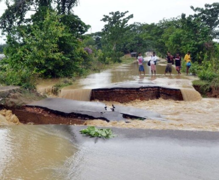 Floods washed away a huge portion of Nagaon to Kampur road at Kathiatoli Village, Assam, India.