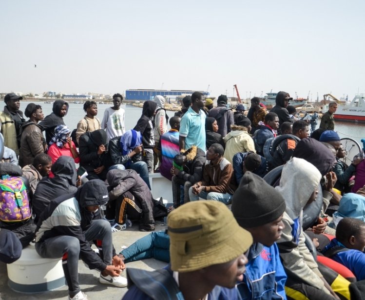 Group of migrants on a boat attempting to cross the Mediterranean
