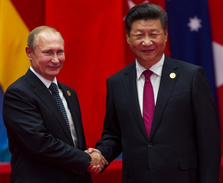 HANGZHOU, CHINA - SEPT. 4. 2016 - Chinese president Xi Jinping (R) welcomes Russian President Vladimir Putin (L) in G20 summit in Hangzhou.