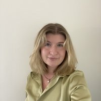 Headshot of Madison Binder. Blonde woman wearing a light green blouse.