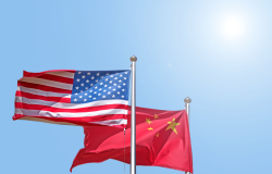 American and Chinese flags flying