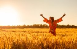 Woman Facing Rising Sun