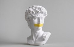 Michelangelo's David head bust with duct tape sealed mouth. 