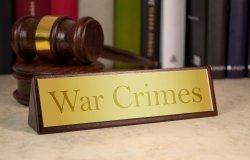 image of plaque reading "War Crimes" with gavel