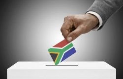 Man Casting Ballot with South Africa Flag