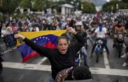 Protesters demonstrate against the official election results declaring President Nicolas Maduro's reelection, the day after the vote in Caracas, Venezuela, Monday, July 29, 2024. (